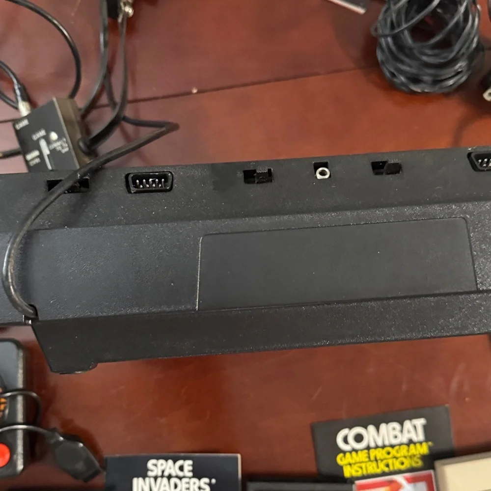 Vintage Authentic Atari 2600 with controllers, games and instruction booklets.